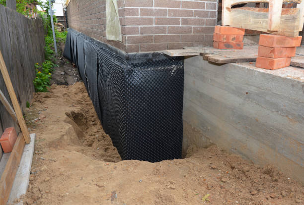 Happy homeowners after waterproofing job in Pewamo
